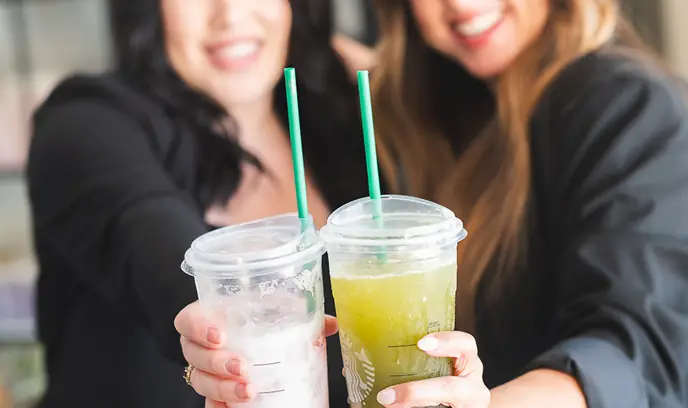 Two Studio One stylists enjoying coffee