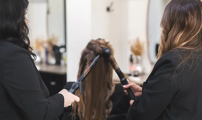 Studio One stylists collaborating on a client