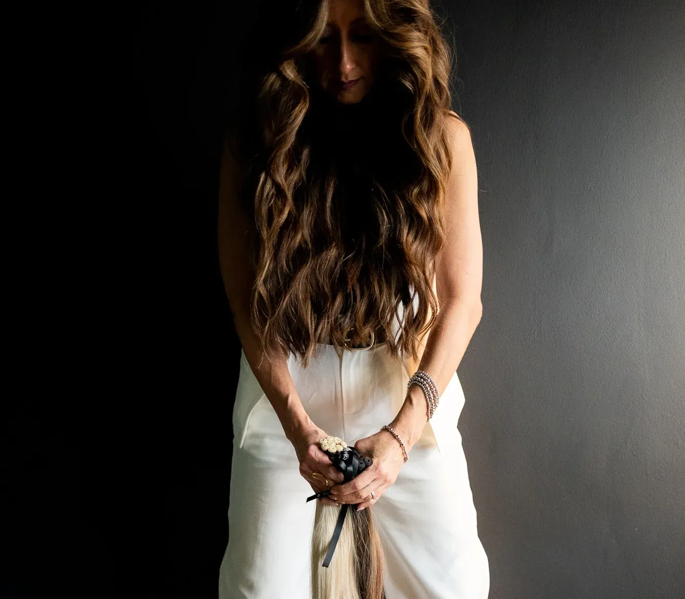 Long, luminous hair styled at Studio One